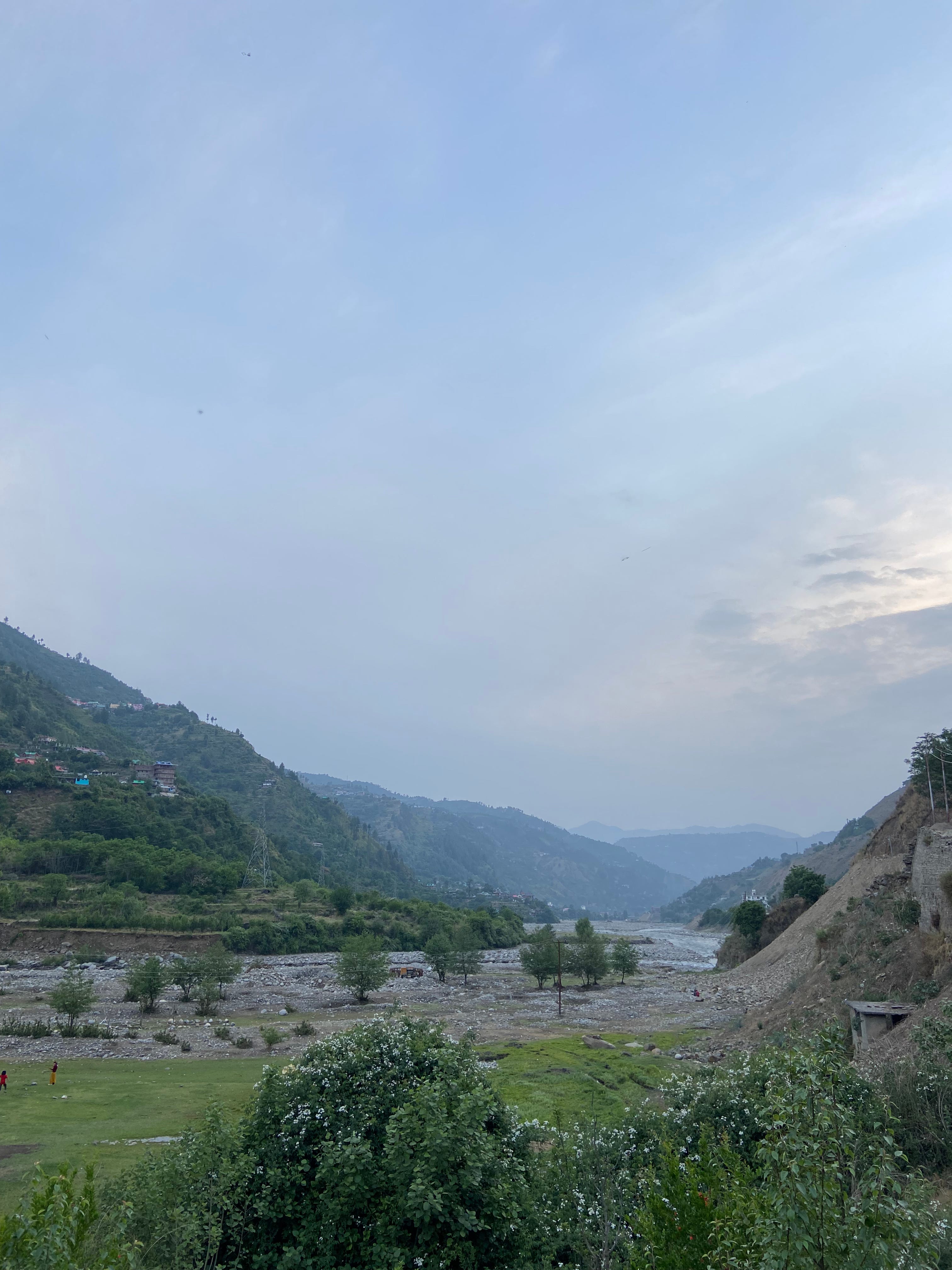 Valley in India with river and vegetation showing the challenges of logistics